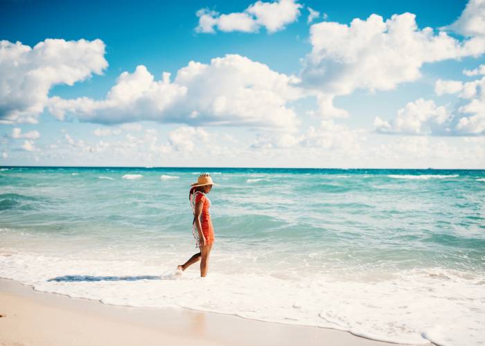 woman walking in water on panama city beach